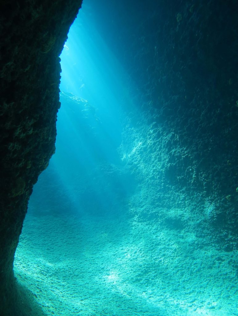 Underwater light at Triton cave, a unique Crete dive site